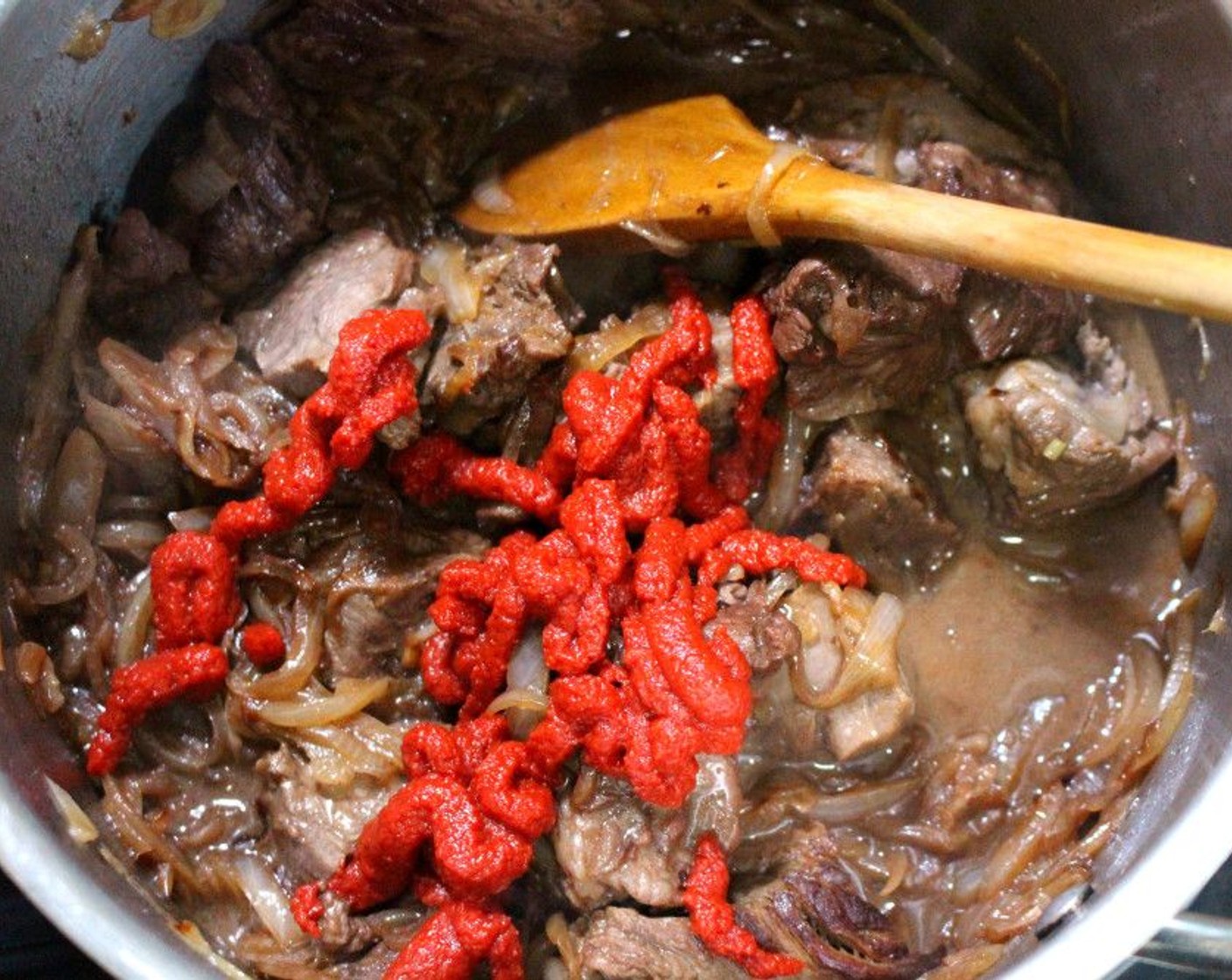 step 5 Add Tomato Paste (2 Tbsp), sauté until lightly caramelized.