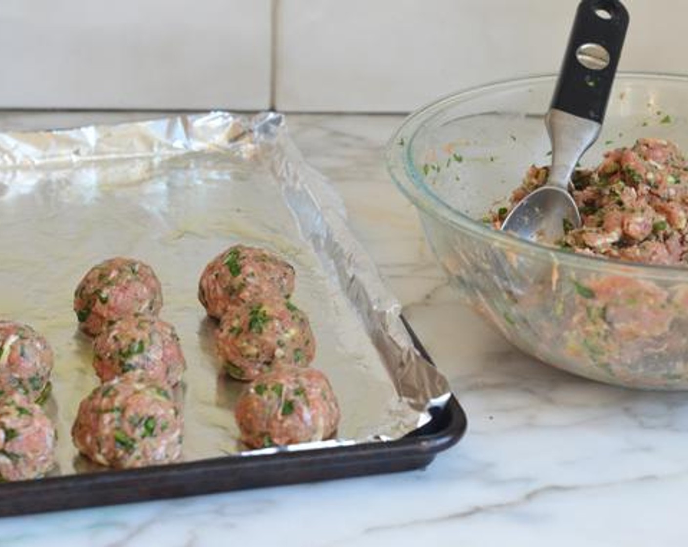 step 4 Shape the mixture into 1-1/2 inch balls and place on the prepared baking sheet. Broil the meatballs until golden brown on top, about 10 minutes.