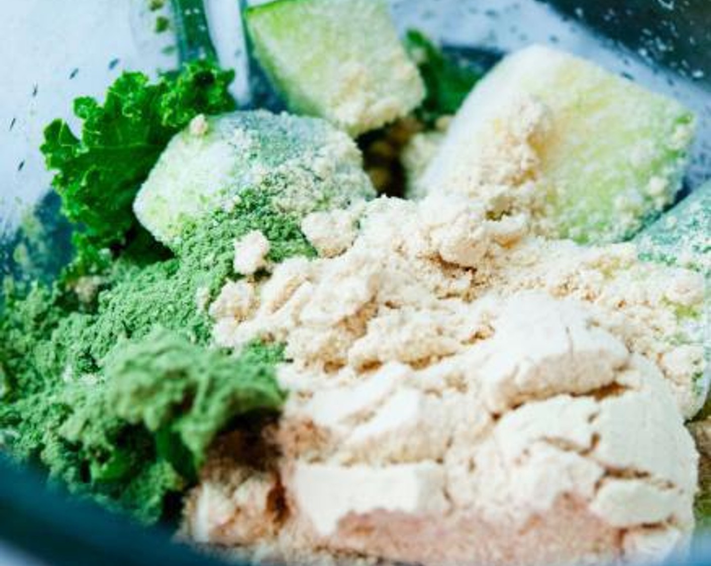 step 1 Into a blender, add and mix the Pea Protein Powder (1 scoop), Zucchini (1/2 cup), Tropeaka Ultra Cleanse (1 Tbsp), Coconut Water (3/4 cup), Baby Kale (4 Tbsp), Pepitas (to taste), and Hemp Hearts (to taste).