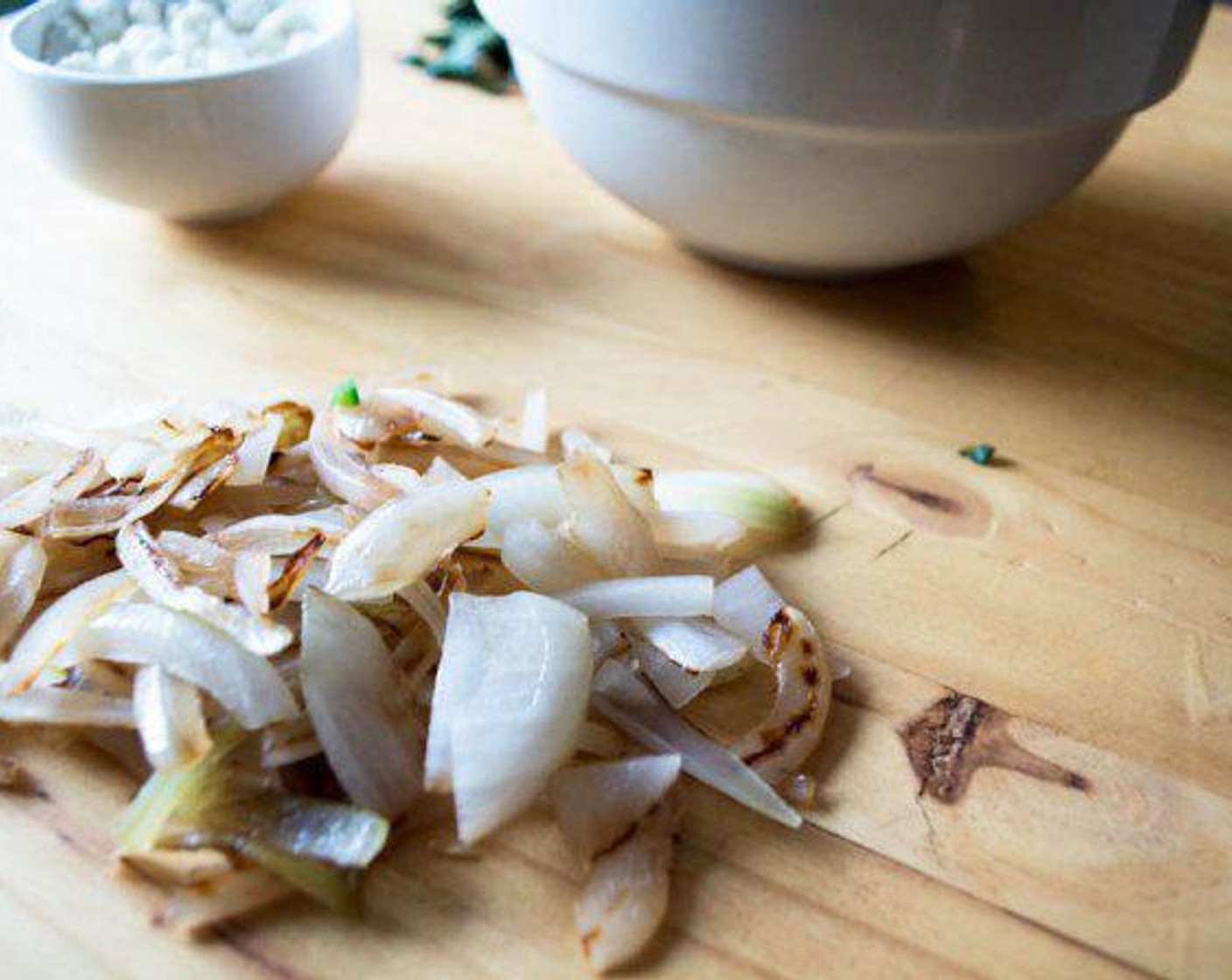 step 4 Add Onion (1/2) to pan and lightly spray with Coconut Oil Cooking Spray (as needed) and saute until transparent and soft.