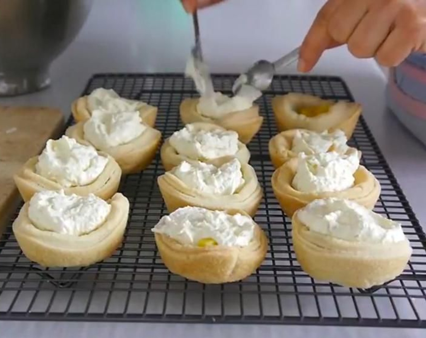 step 8 Start to assemble each tart by adding 3 or 4 squares of fresh mango a tbsp of cream on top. Repeat until you have done all of the tarts. Place the tarts in a air tight seal container and place in the fridge over night. This will help the gelatin and cream become more of a mousse like texture