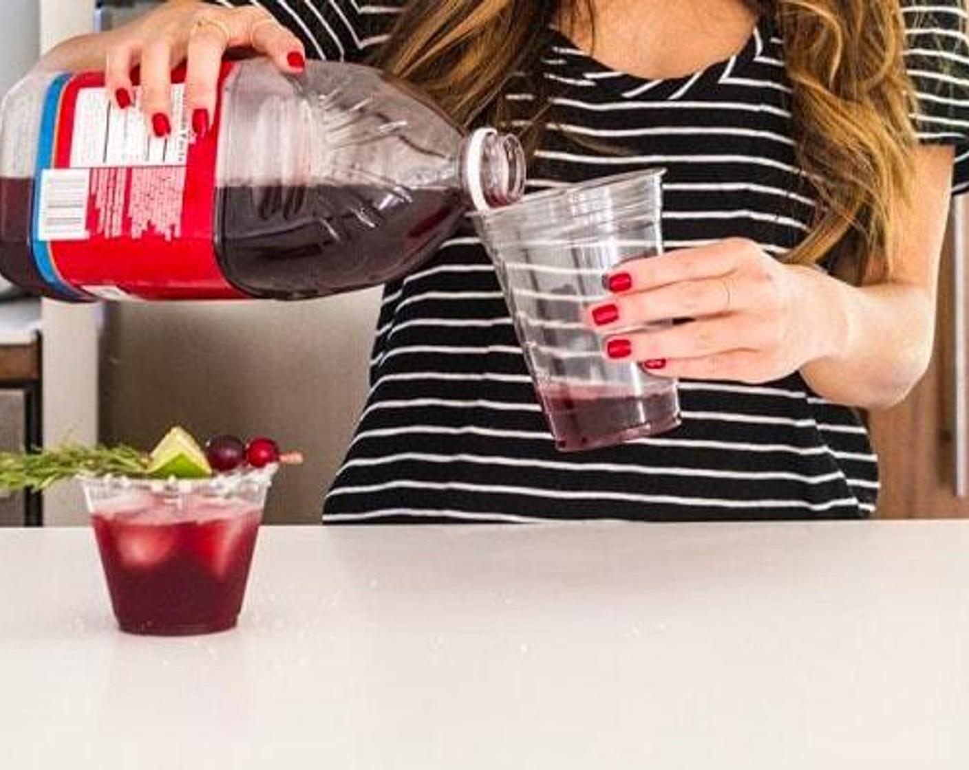 step 1 Use a solo squared cup and a 10-ounce clear cup to create a cocktail shaker. Add Cranberry Juice (2 fl oz), PATRÓN® Silver Tequila (1.5 fl oz), Triple Sec (0.5 fl oz), Ice (1 handful) and Salt (to taste). Shake to combine.