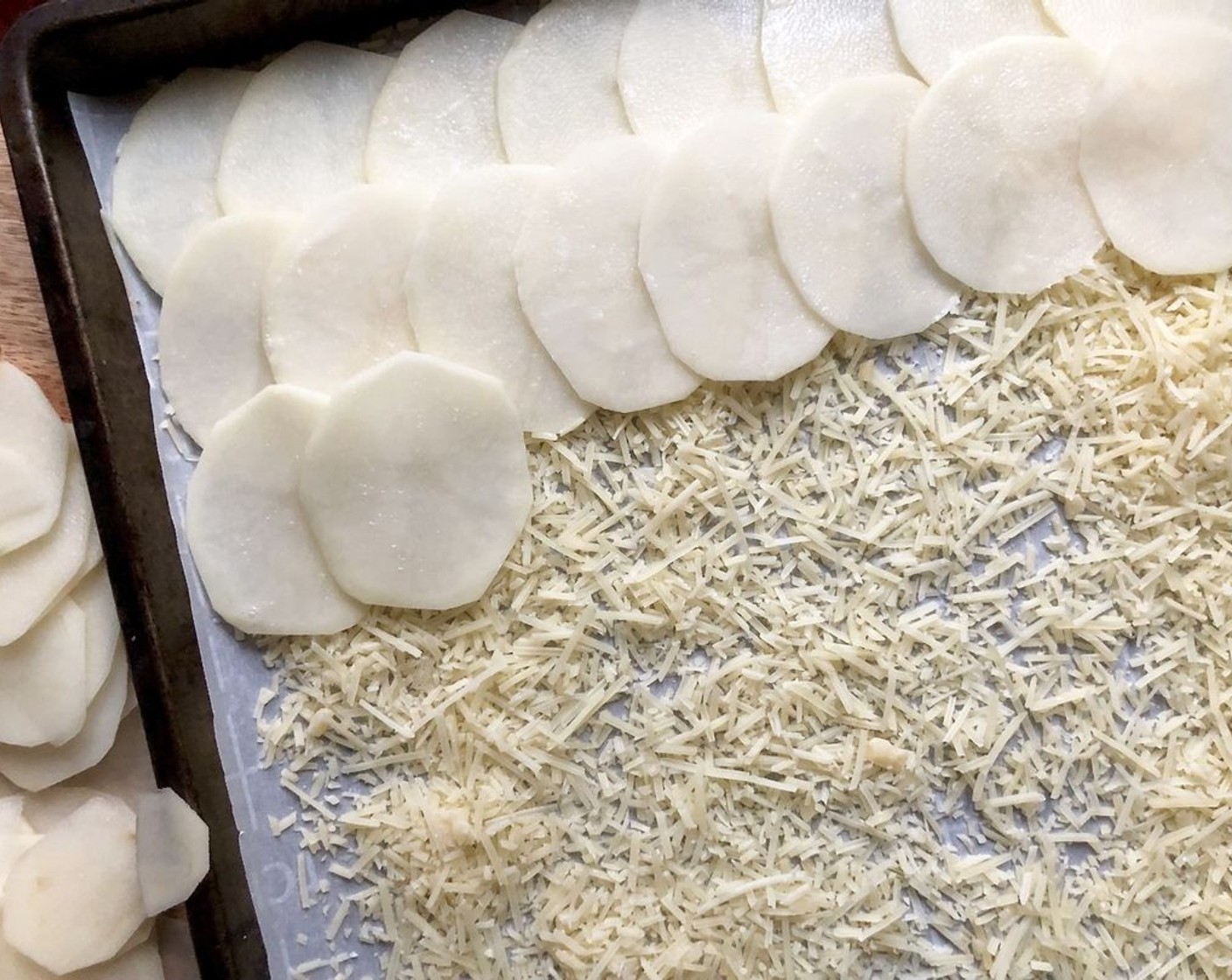 step 6 On the prepared baking sheet, sprinkle half of the Grated Parmesan Cheese (2 cups) and spread until it is evenly covering the parchment paper. Sprinkle the rest of the parmesan cheese evenly over the potatoes.