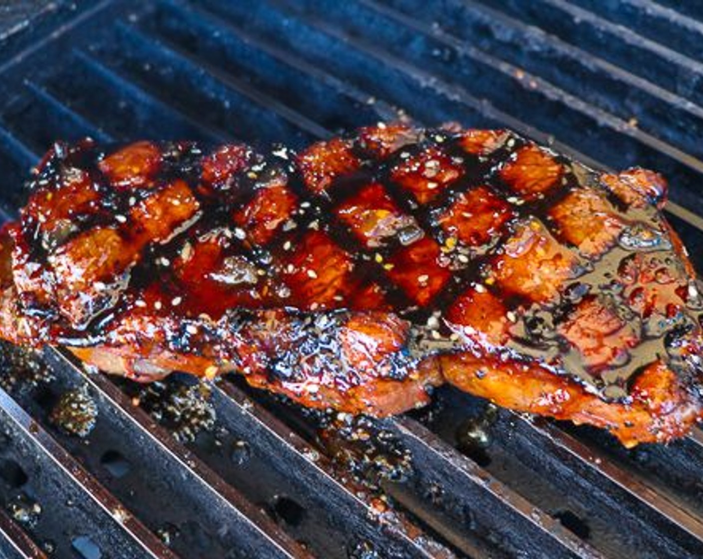 step 7 Flip the sirloin and repeat the process. Brush the top of the steak with warm Jack Glaze 2 minutes before removing from grill.