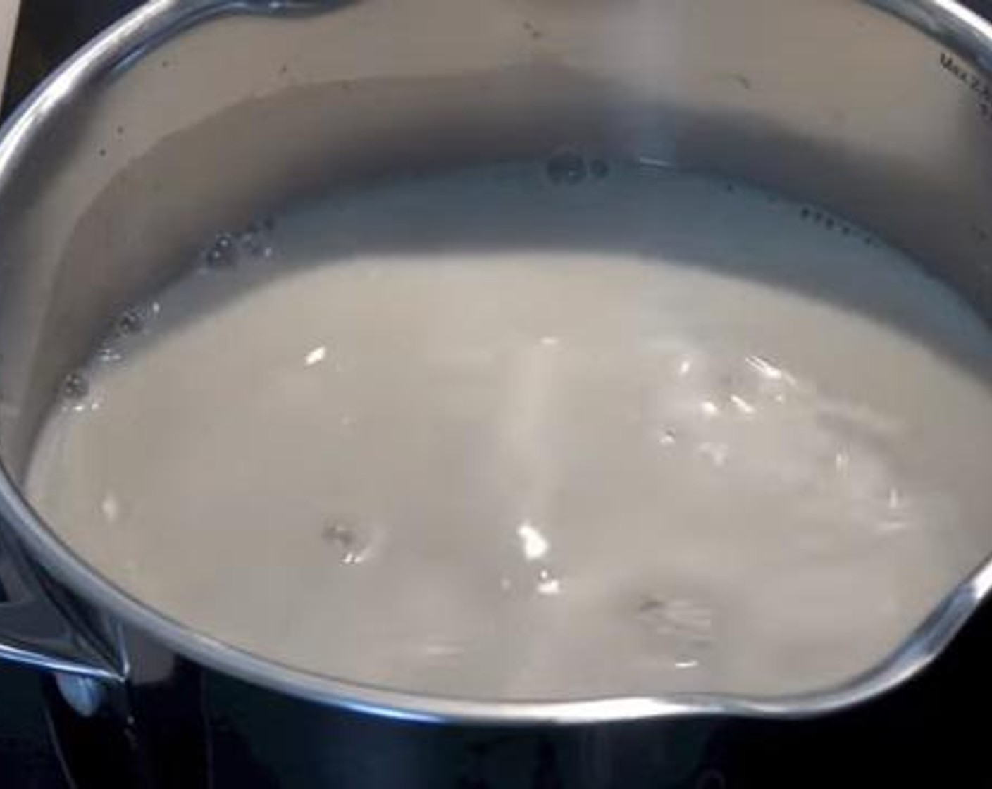 step 1 Into a pot over medium heat, add the Vegetable Stock (2 cups) and Milk (1/2 cup). Mix together and wait until the mixture simmers.