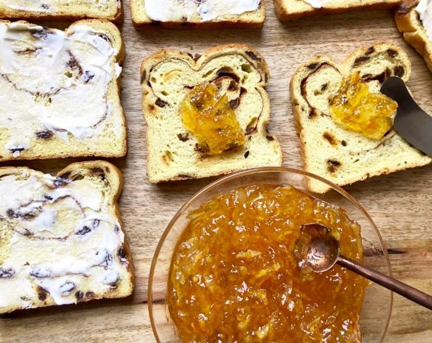 step 3 Spread remaining Cinnamon Raisin Bread (12 slices) with 2 teaspoons of Orange Marmalade (1 jar) each.