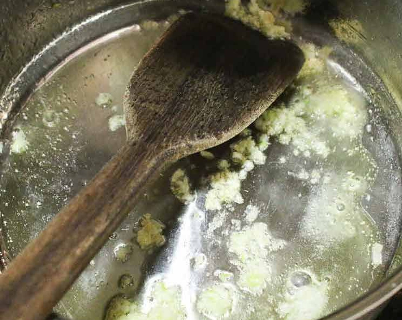 step 1 Heat the Olive Oil (1 Tbsp) in a pot, add the Garlic (1 clove) and fry for 2-3 minutes until the garlic turns slightly golden in colour.