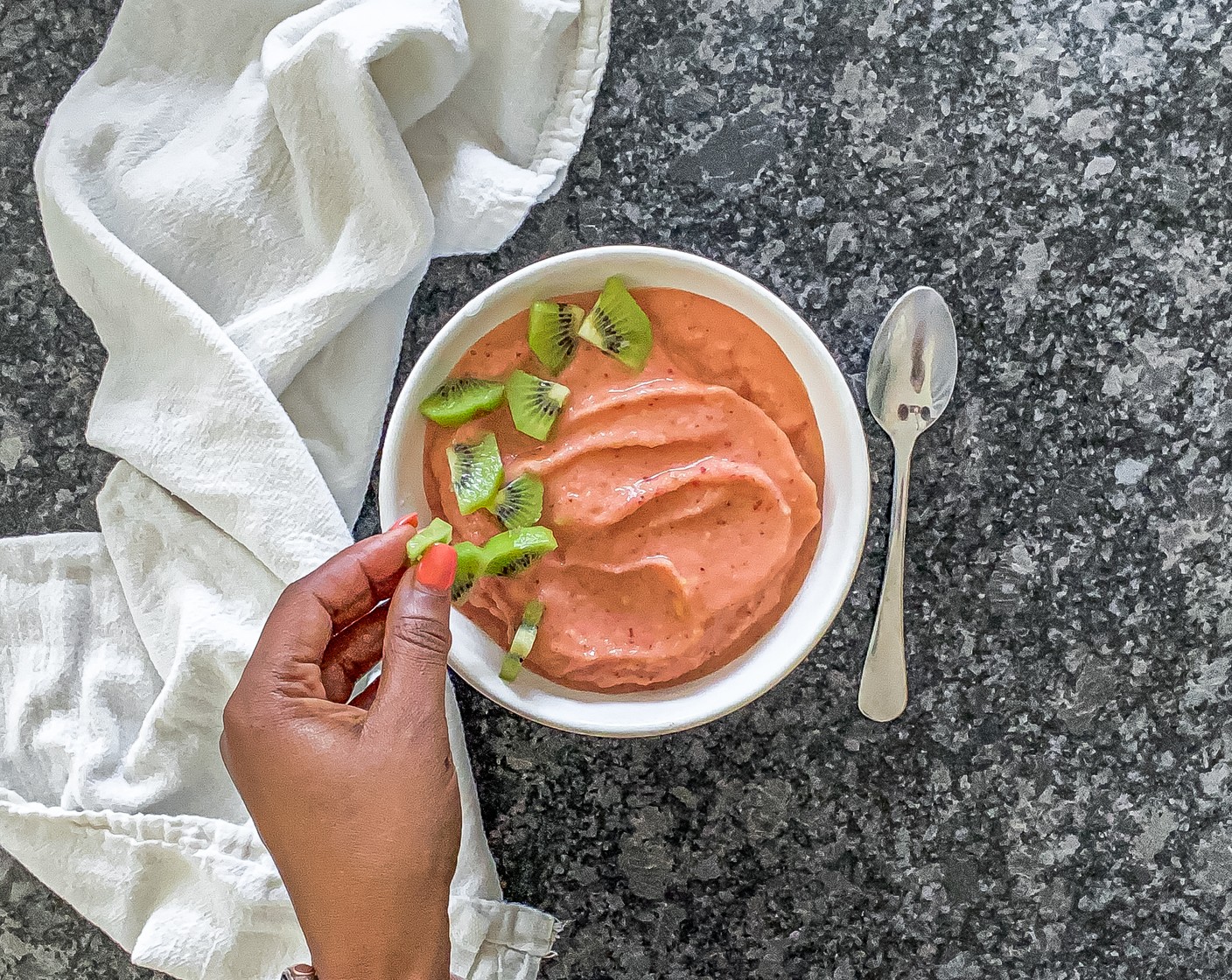 step 3 Pour the smoothie into a serving bowl, add desired toppings like Granola (to taste), Unsweetened Coconut Flakes (to taste), Fresh Fruits (to taste), and serve immediately while cold!