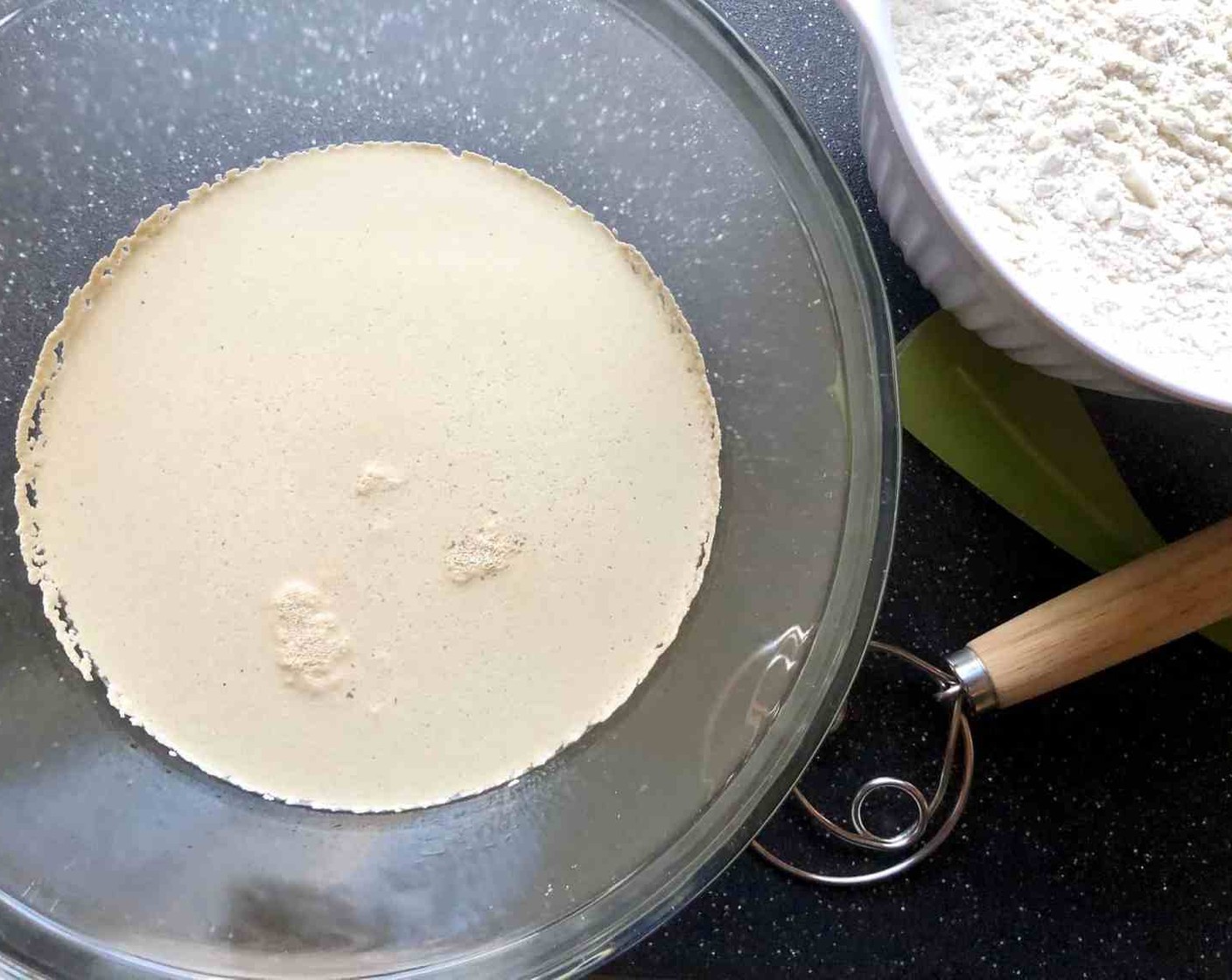 step 1 In a large 5 to 6-quart bowl or lidded food container, add Active Dry Yeast (1 Tbsp) and Kosher Salt (1 Tbsp) to the Water (3 cups). Give it a quick stir.