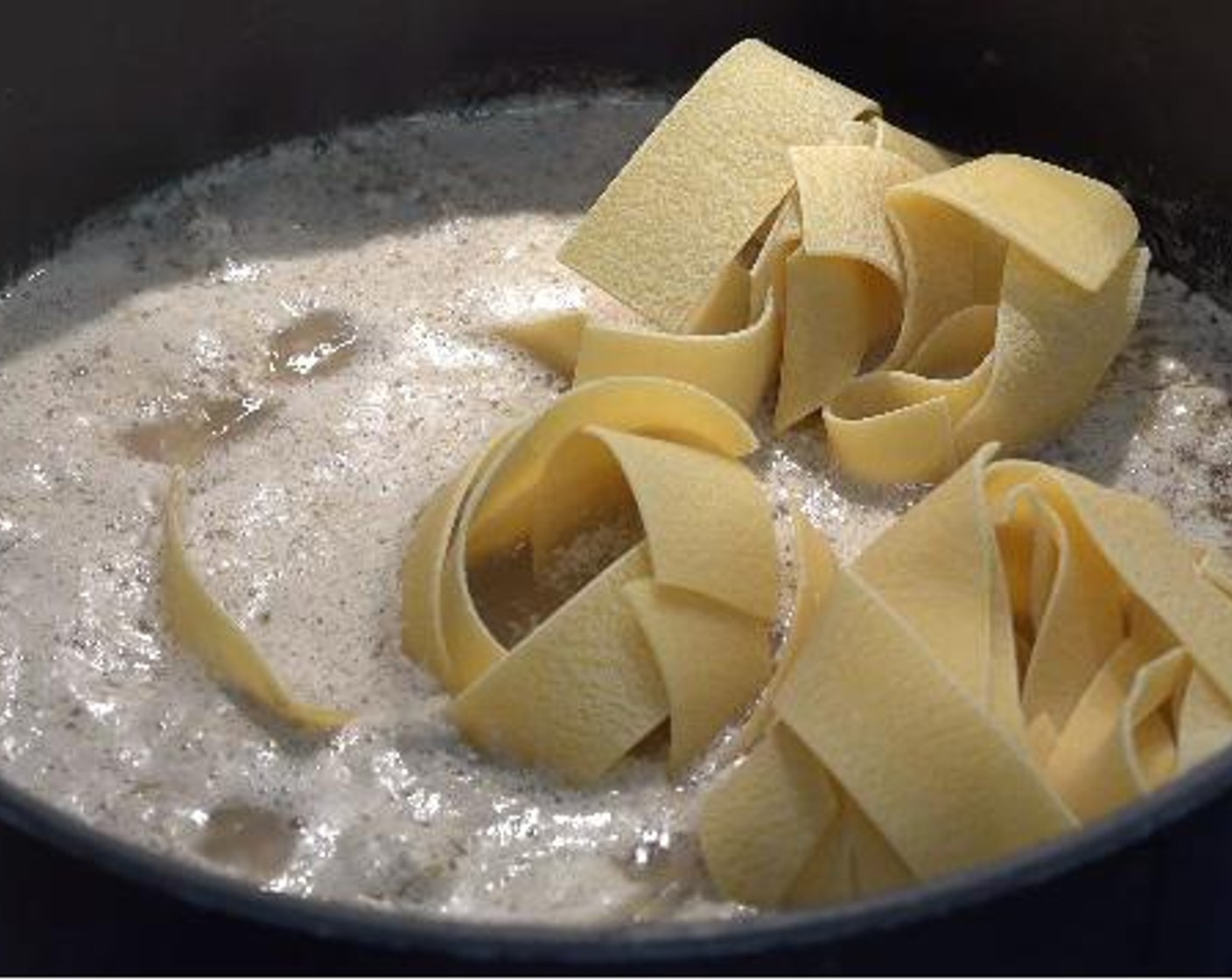 step 4 Once the mixture comes to boil, add in the Pappardelle Pasta (14 oz), and as the pasta starts to soften, gently stir through the mixture for about 8 minutes.