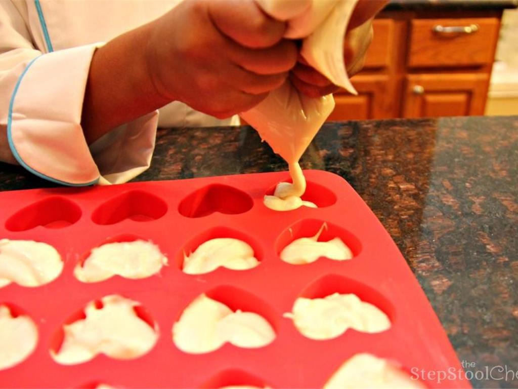 Step 1 of Cupcake Fondue Recipe: Mix the White Cake Mix (1 package) according to the package's instructions. Add the batter to a sandwich bag, seal the top, and cut one of the corners to make a homemade pastry bag. Pipe up about half and be careful not to overfill.