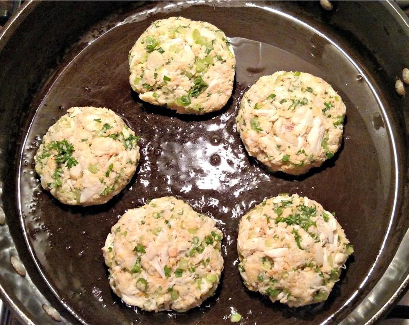 step 5 Preheat a large pan with Olive Oil (as needed). Saute your crab cakes for 3 minutes per side over medium-low heat, then drain on paper towels.