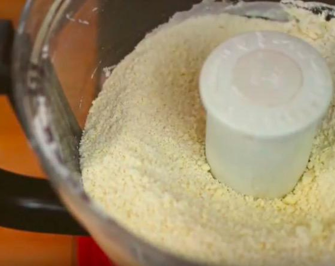 step 2 Drizzle in Eggland's Best Classic Egg (1), Water (2 Tbsp), and Distilled White Vinegar (1/4 tsp). Continue to blitz until the mixture turns from white to yellowish crumbs. If the dough can be pitched into a dough, transfer onto a kneading surface. Else, add more water and blitz.
