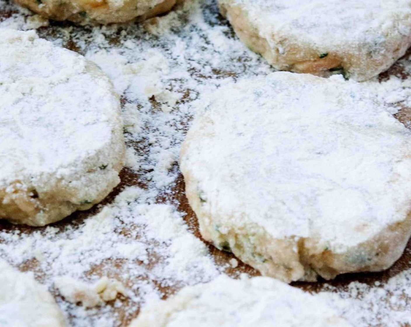 step 7 Using your hands divide the mixture into 8 large or 12 small balls and pat and shape each ball into a fishcake, roughly 2 centimeters thick. Coat them in All-Purpose Flour (1/4 cup).