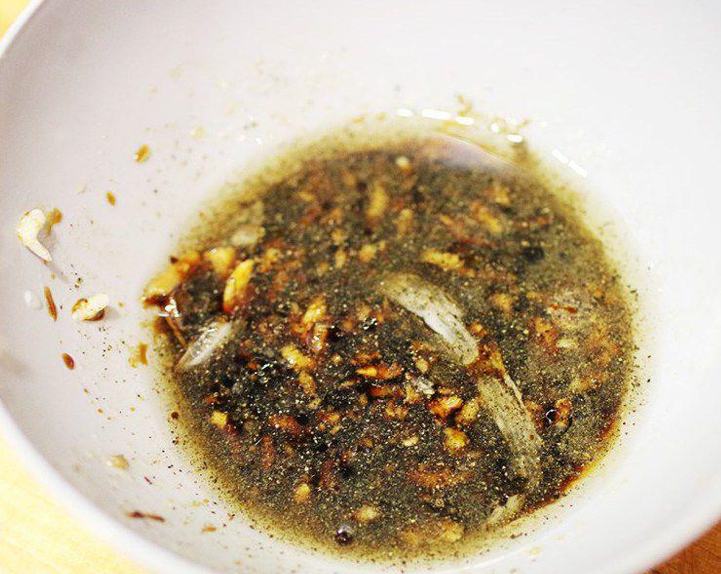 step 2 Mix Garlic (1 clove), Light Soy Sauce (2 Tbsp), Dark Soy Sauce (1 Tbsp), Mirin (1 Tbsp), Salt (1/4 tsp), and Ground Black Pepper (1 pinch) in a small mixing bowl, set aside.