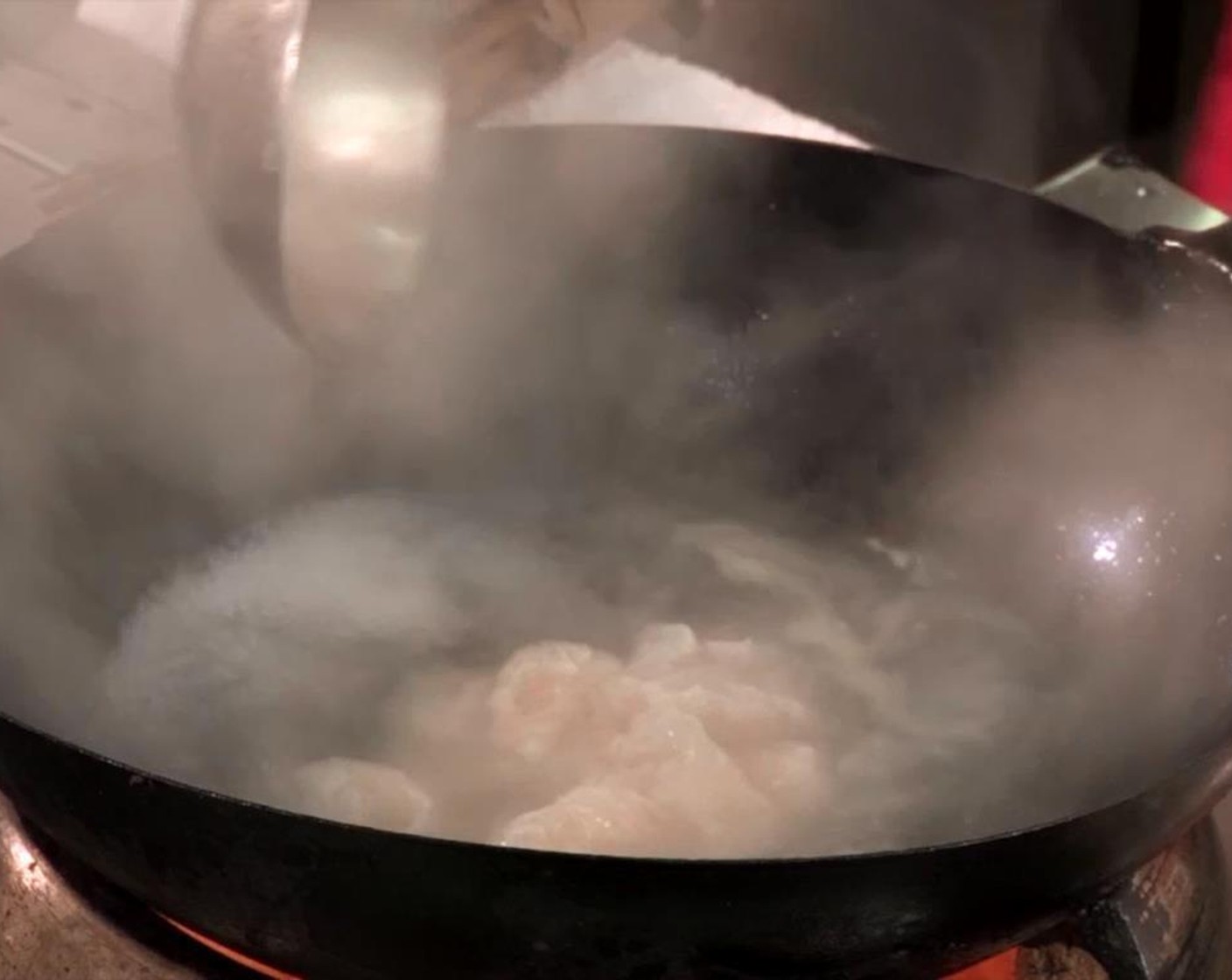 step 4 Put sliced threadfin in boiling water for 8 minutes until cooked.