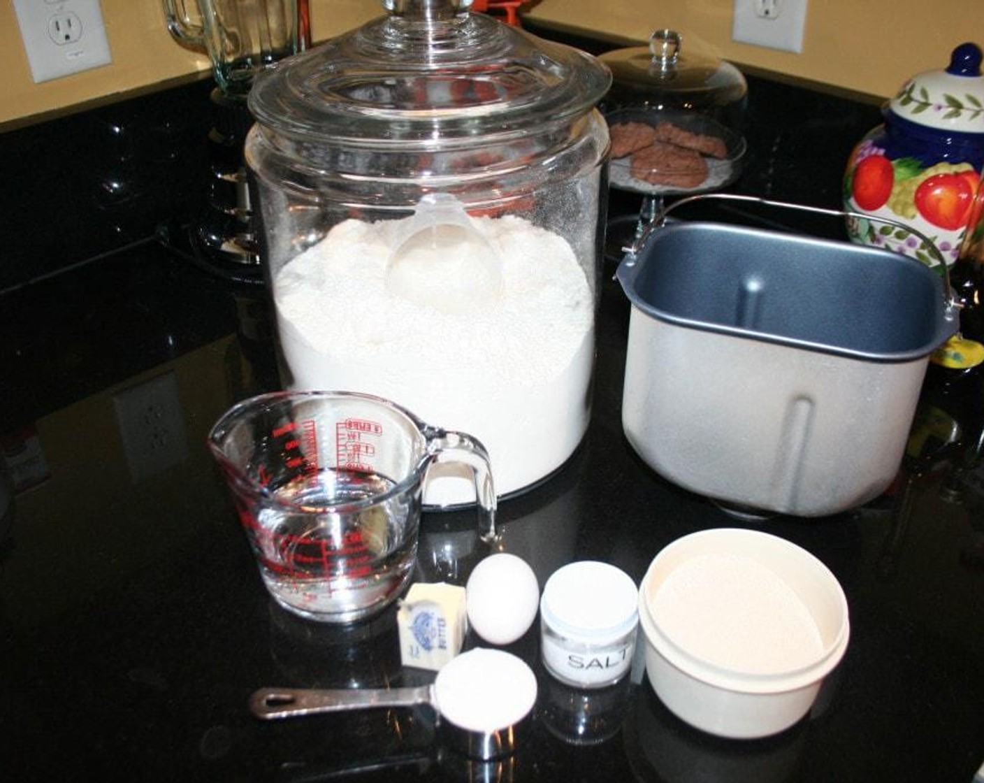 step 1 Gather Water (1 cup), Butter (3 Tbsp), Vanilla Extract (1 tsp), Egg (1), Salt (1 tsp), Bread Flour (3 1/3 cups), and Instant Dry Yeast (1 Tbsp).