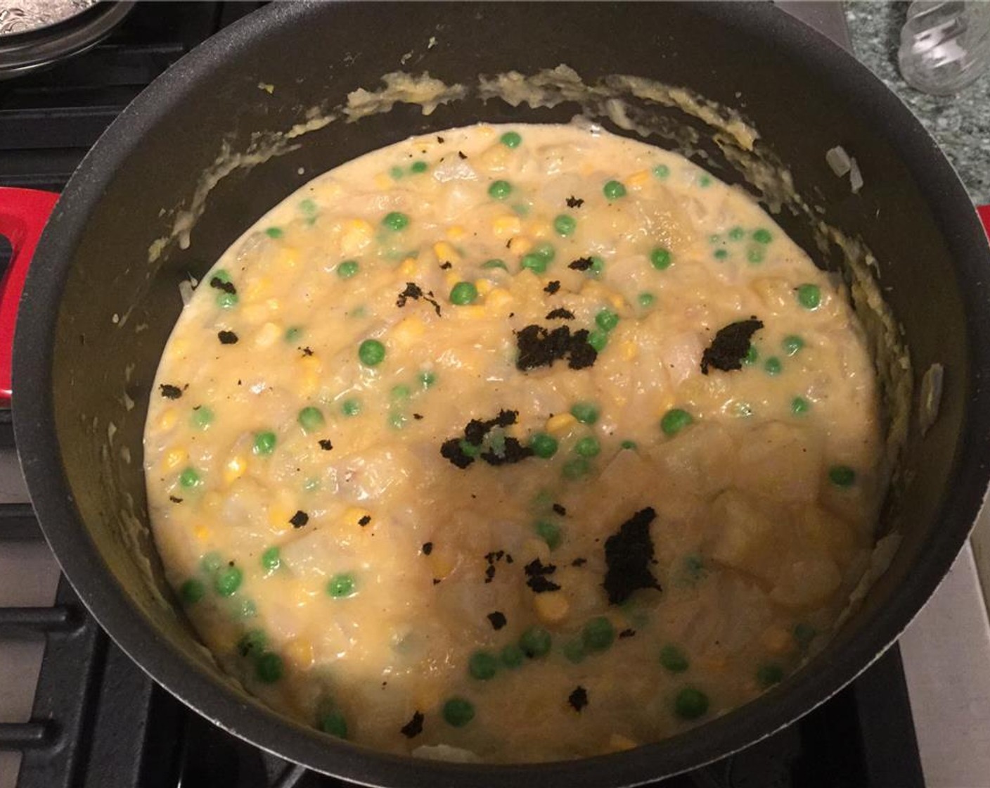 step 12 Add Evaporated Milk (2.5 fl oz), Aji Amarillo Paste (1/2 tsp), Aji Panca Paste (1/2 tsp), and Huacatay Paste (1/2 tsp) and stir. Let simmer for 2 minutes.