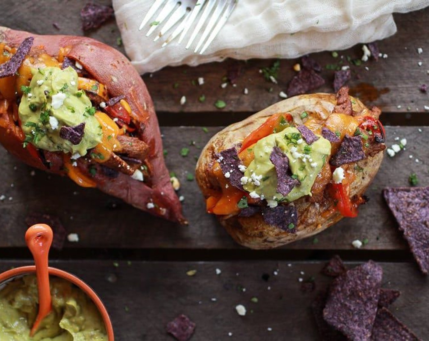 Steak Fajita Stuffed Baked Potatoes with Avocado Chipotle Crema