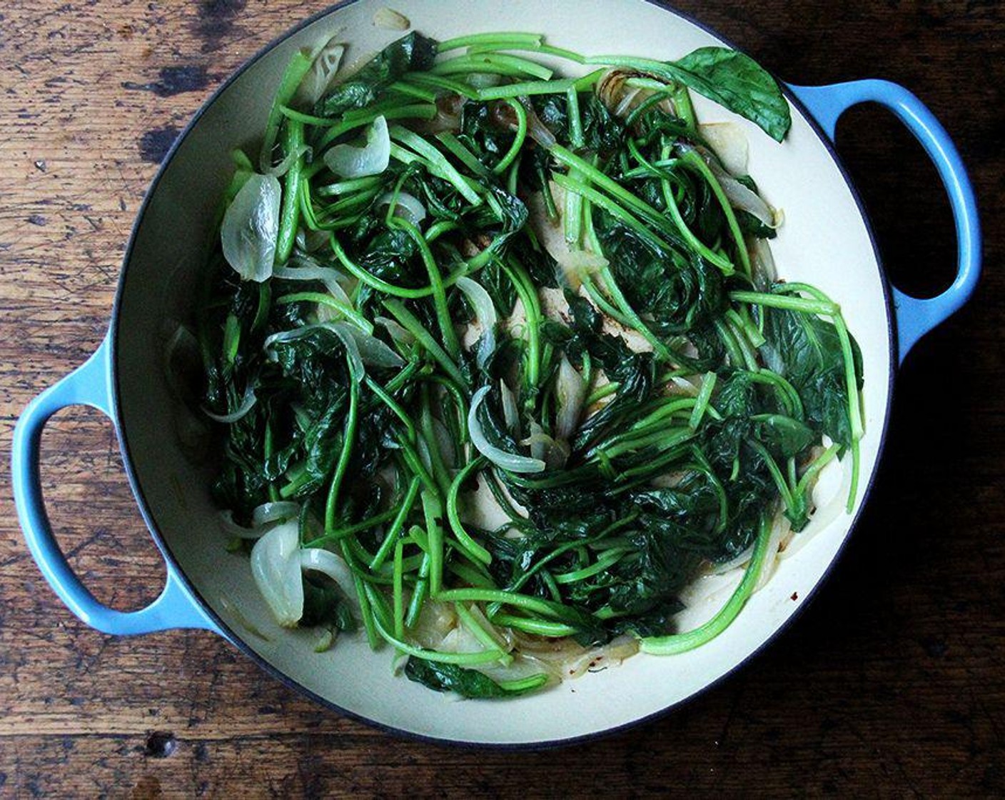 step 4 Cook over medium to medium-high heat until greens shrink way down—use tongs to flip the greens around and help them wilt. Season with a pinch of Kosher Salt (to taste). Turn off the heat.