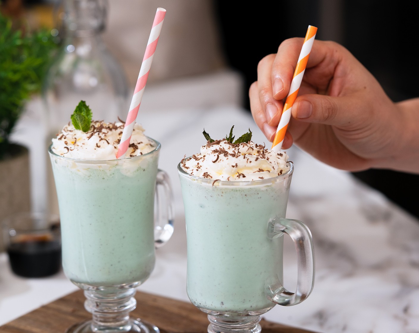 step 2 Pour the milkshake into serving glasses. Optionally, garnish with Whipped Cream (to taste), Semi-Sweet Dark Chocolate (to taste), and Fresh Mint Leaves (to taste).