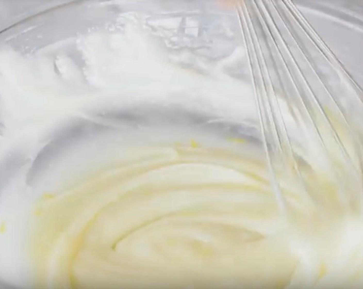 step 13 Meanwhile, make the glaze. In a mixing bowl, whisk Cream Cheese (1/2 cup) until smooth. Add Powdered Confectioners Sugar (1 cup) and zest of 1 lemon and juice of 2 Lemon (1). Whisk together until smooth. Set aside.