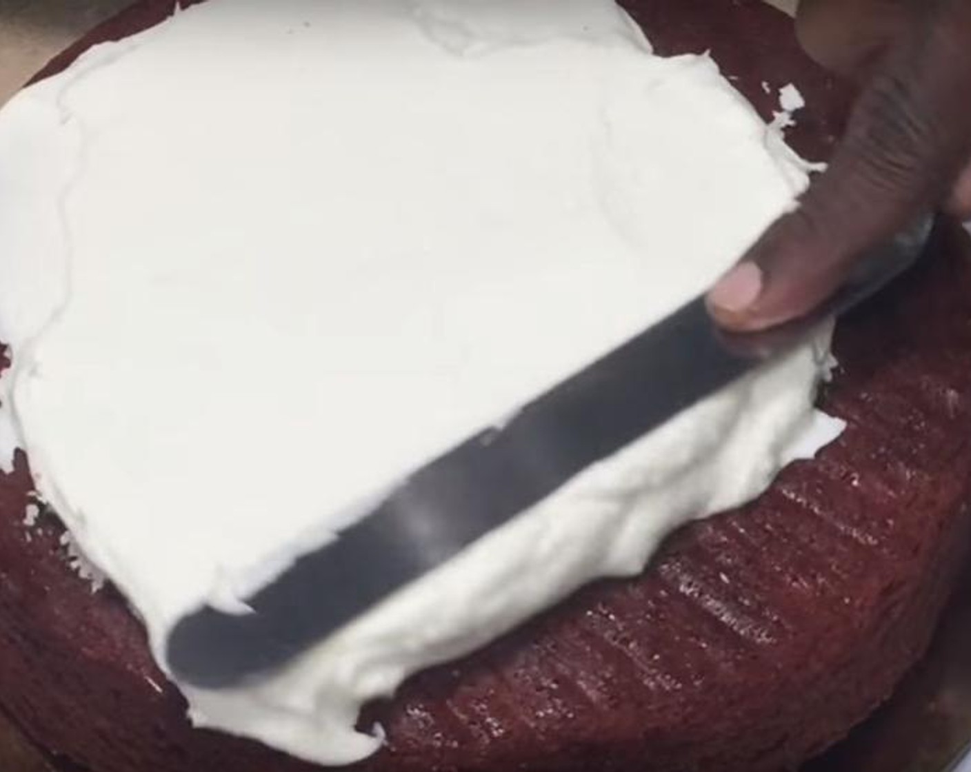 step 4 Take out the cakes from the tins. Cover the top and bottom of one cake with the frosting of your choise and put on the second one as a next layer. Cover the cake with more frosting. Put it back into the freezer, than add another coat of frosting. Serve!