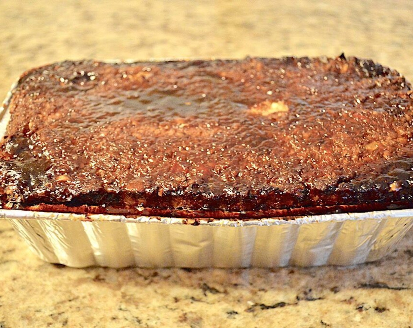 step 4 In a bowl, mix the Brown Sauce (2 Tbsp), Dark Brown Sugar (1 Tbsp) and Balsamic Vinegar (1 Tbsp) together thoroughly and pour it over the loaf, letting it soak in. Put the loaf pan on a baking sheet to catch any potential spillover and bake it for 50 minutes.