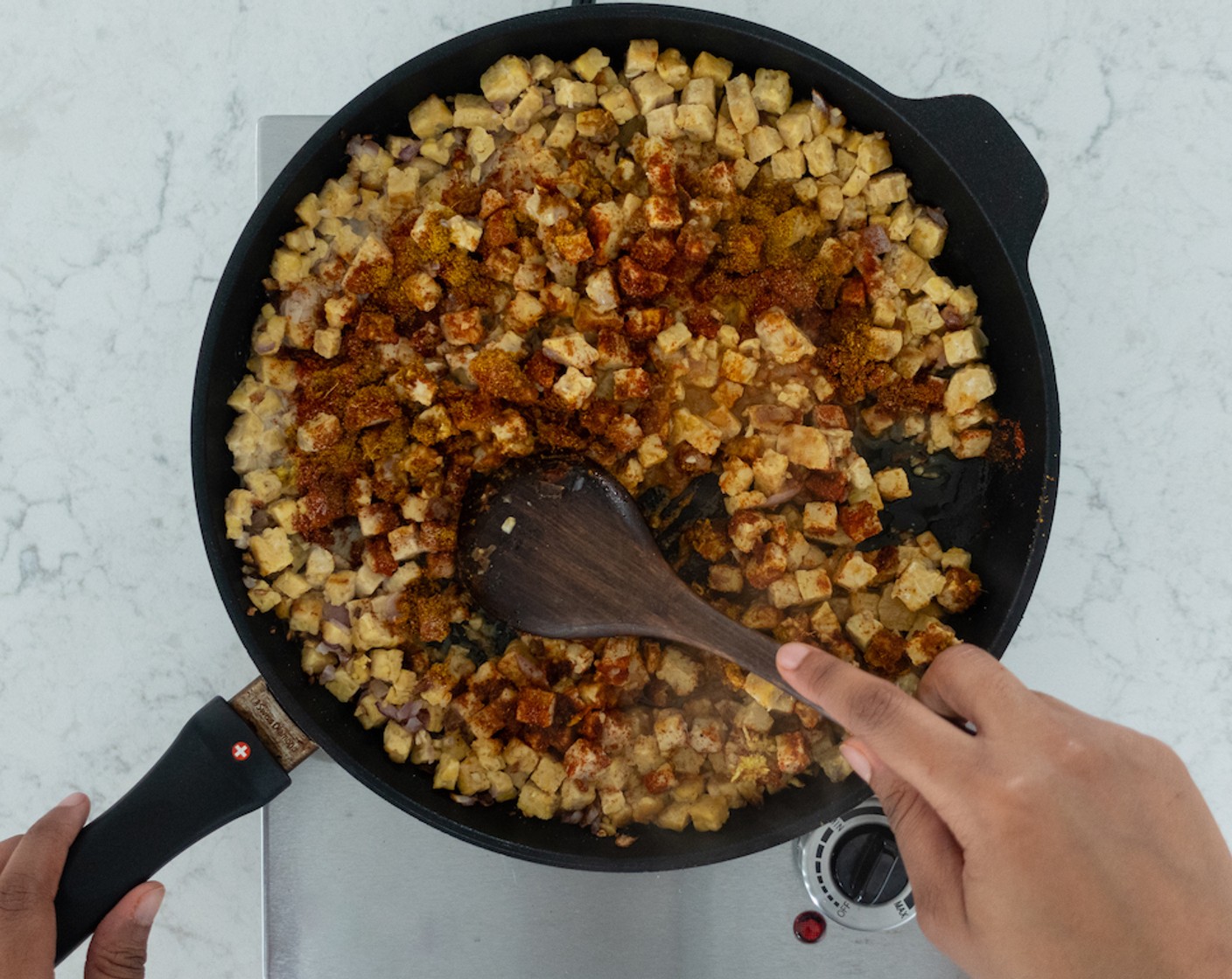 step 4 Add tempeh and brown for 2-3 minutes. Stir in Vegetable Broth (1/2 cup), Full-Fat Coconut Milk (1/2 cup), Ground Cumin (1/2 Tbsp), Paprika (1 Tbsp), Curry Powder (1 Tbsp), Chili Powder (1/2 tsp), Fine Sea Salt (1 tsp), Lemon (1) and ginger, combining till all ingredients fully incorporated.