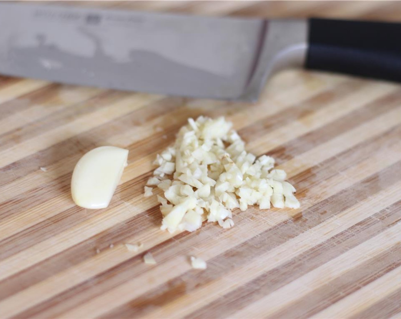 step 1 Preheat your oven to 200 degrees C (400 degrees F). Finely chop the Onion (1) and Garlic (2 cloves). Chop the Tomato (1).