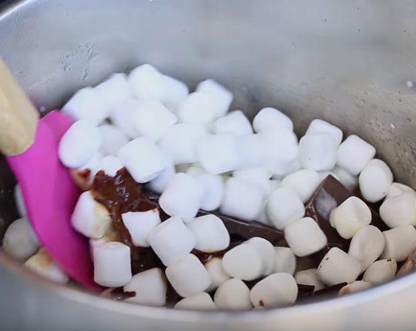 step 3 Remove from heat, stir in Vanilla Extract (1 tsp), 72% Dark Chocolate (1 cup), Almonds (1/2 cup) and Mini Marshmallows (2 cups). Stir fast for 1 minute or until chocolate and marshmallows are melted.