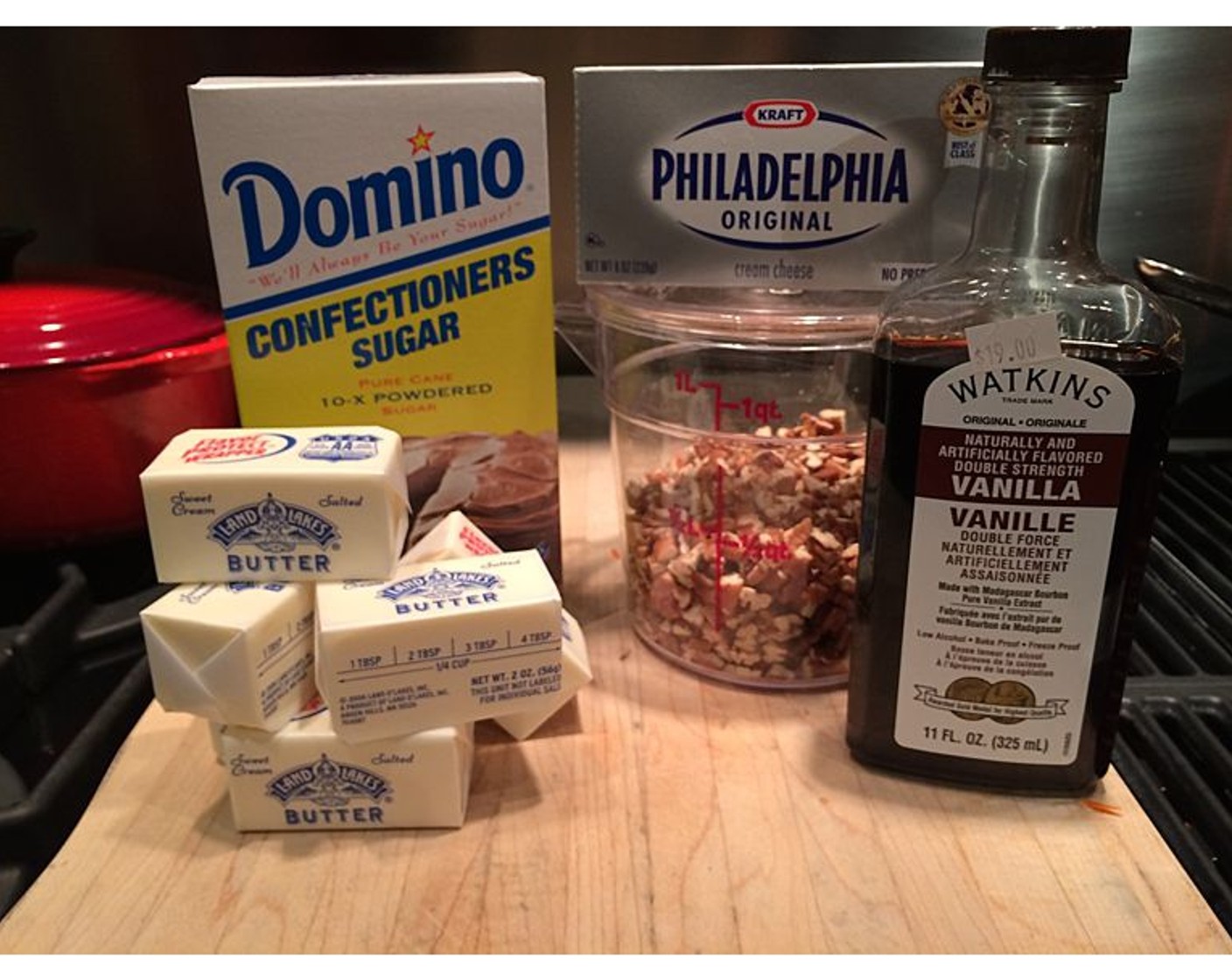 step 8 Add Powdered Confectioners Sugar (4 cups) and Vanilla Extract (2 tsp), mixing until light and fluffy. Using a spatula scrape down sides of bowl. Stir in Pecans (1/2 cup).