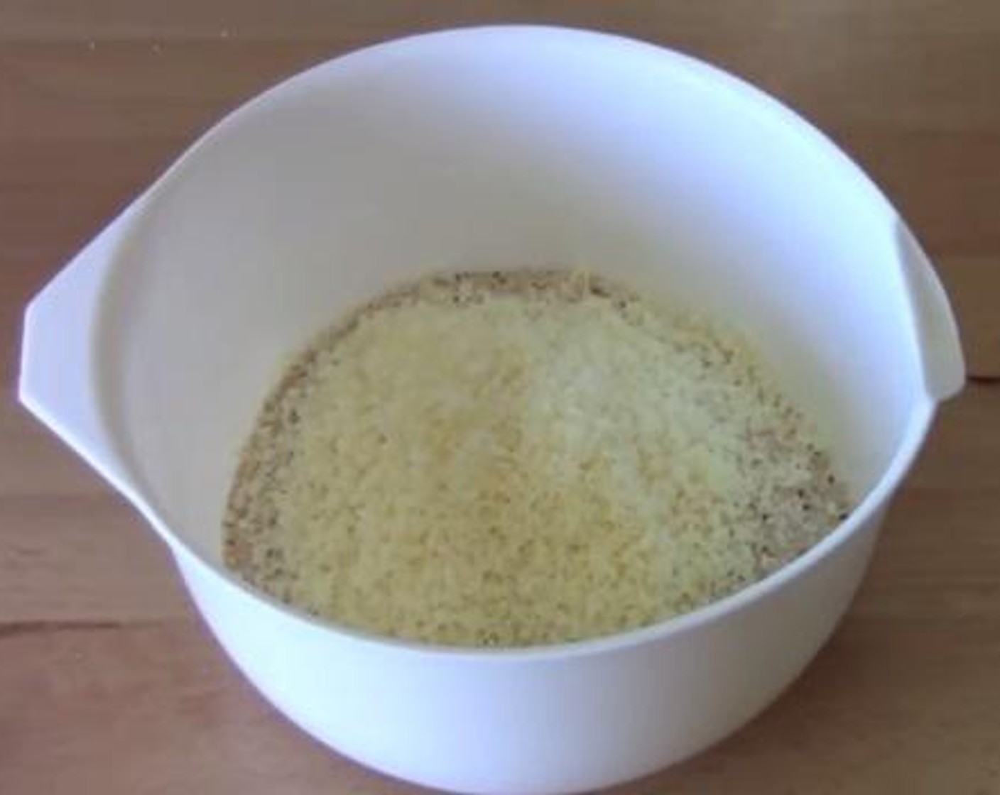 step 3 In a mixing bowl add and mix the FIne Dry Breadcrumbs (2 cups), Simply Organic Garlic Powder (1 tsp), Parmesan Cheese (1 cup), Salt (to taste), and Ground Black Pepper (to taste). Into 2 other separate bowls, place the Eggland's Best Classic Eggs (2) and All-Purpose Flour (1 cup) separately.