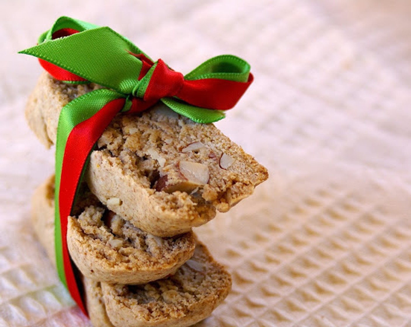 step 12 Dip up to 1/2 of each biscotti in melted chocolate and lay on wax paper. Allow to sit for up to an hour to harden, or put in the fridge to speed up the process. Serve and enjoy!