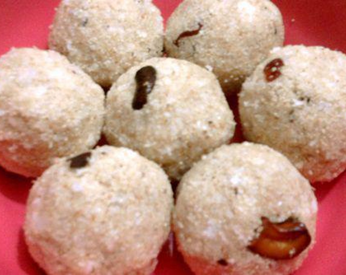 step 4 Start to roll the mixture into balls. Before taking the mixture to your hands you can dip your hand in milk This will help you to roll the ladoo easily.