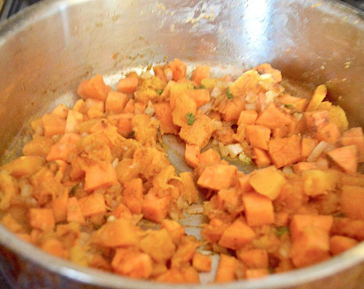 step 2 Once cooked, transfer to a plate and add the Butternut Squash (2 cups) and Sweet Potato (1) to the same pan to cook, stirring occasionally.