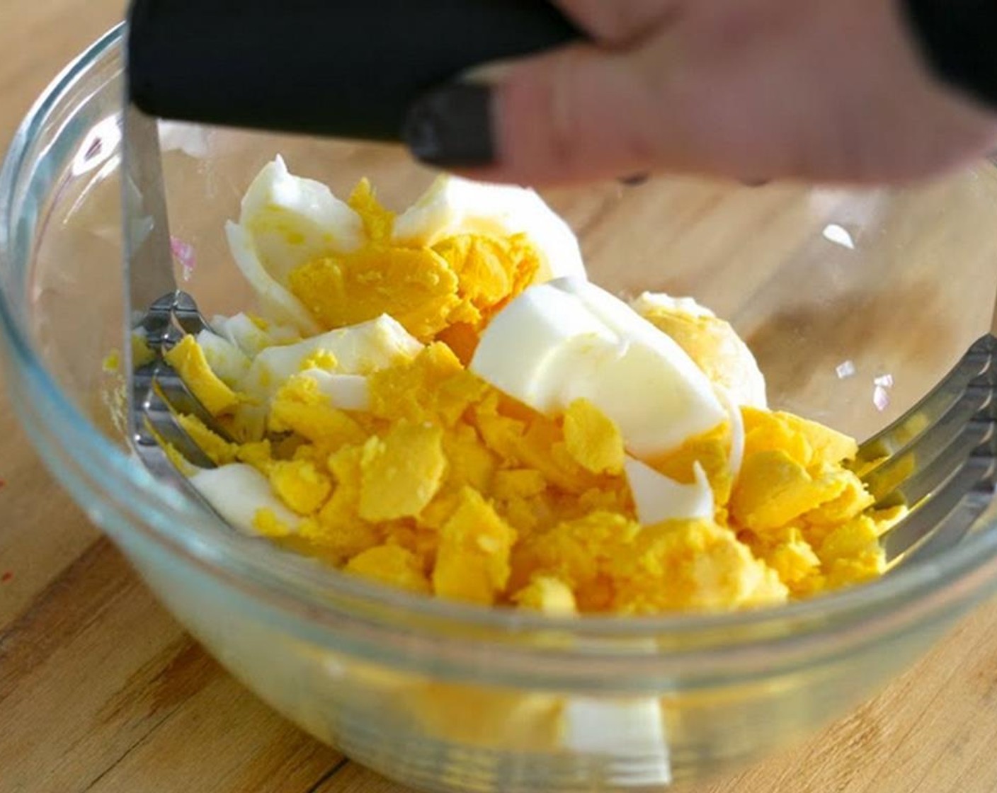 step 9 Smash the yolks with a potato masher until sand-like.