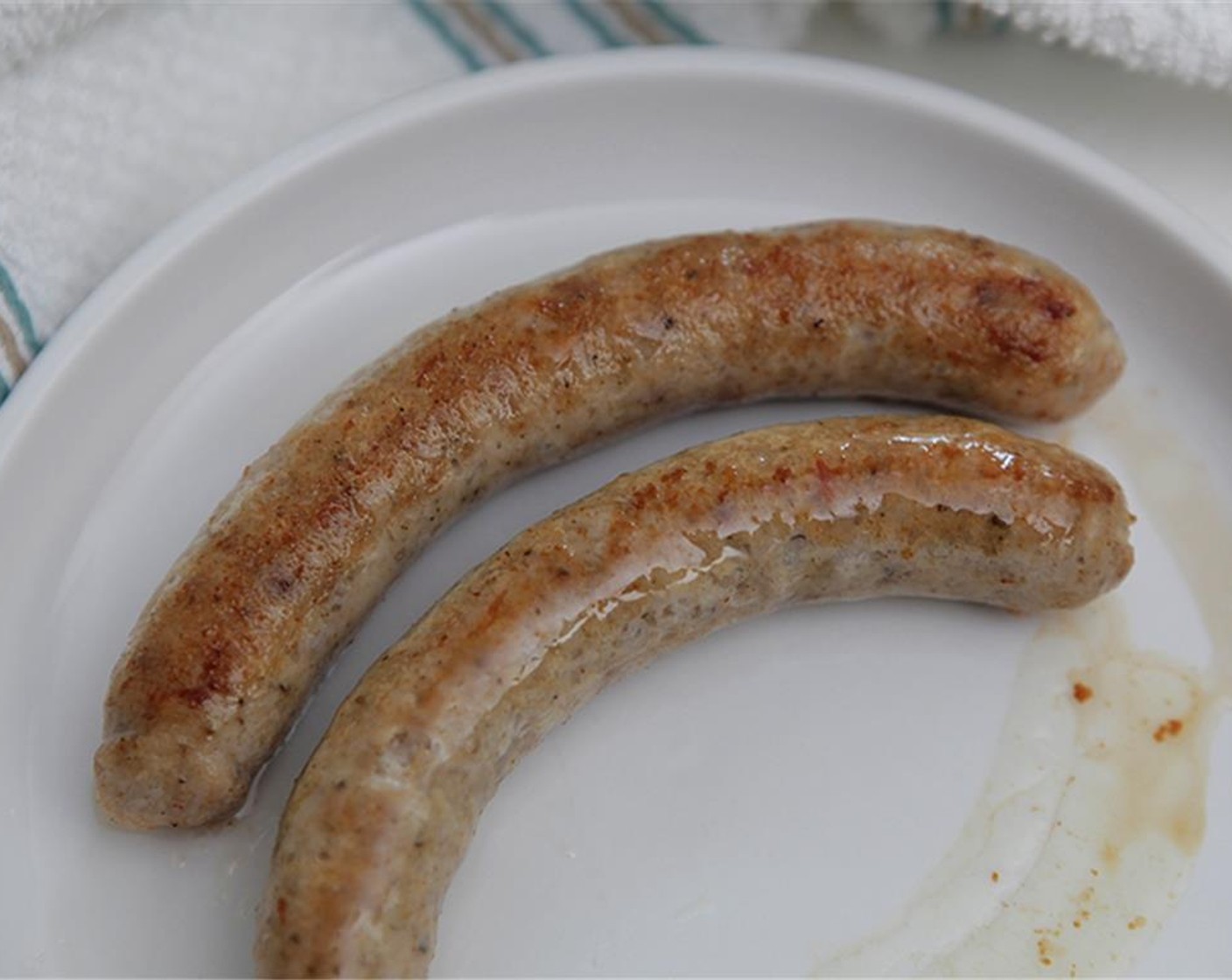 step 6 Heat a saute pan over medium-high heat. Add Olive Oil (1 Tbsp), heat, then add the Chicken Sausages (4 pieces). Brown all around, and remember that the sausage is already fully cooked. Once the sausage is browned, remove it from the pan, and set it aside.