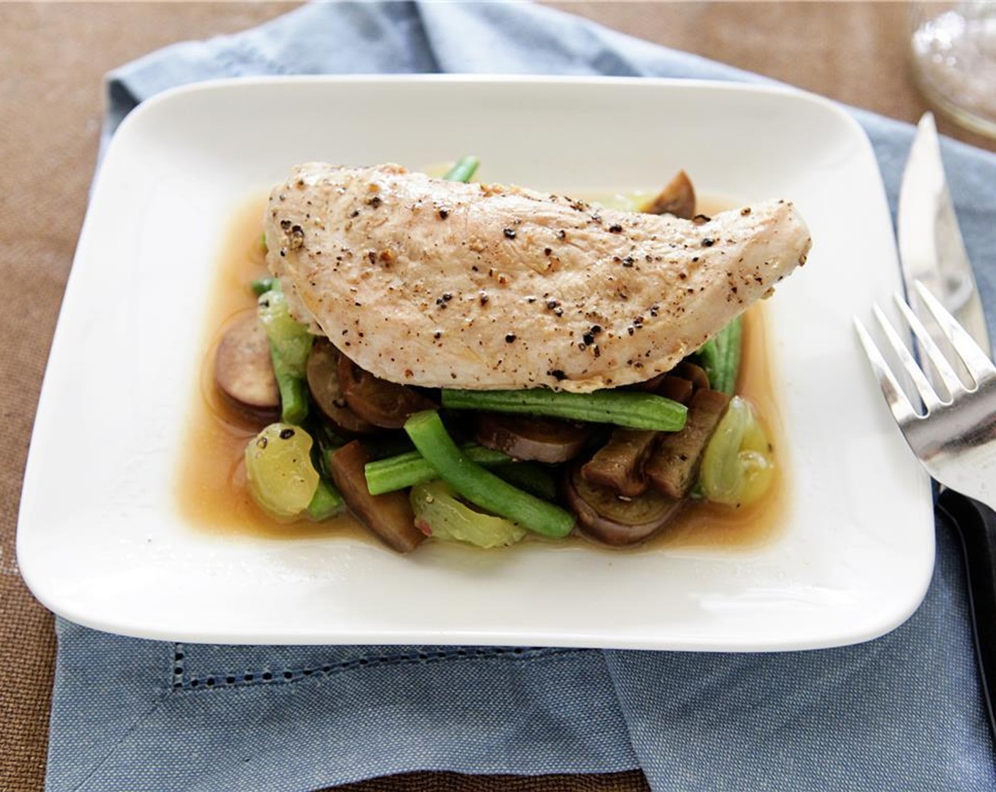 step 9 Place a mound of green beans, japanese eggplant and muscadines in the center of the plate, then top with Parmesan Cheese (1/3 cup). Carefully set the chicken on top of the vegetables. Enjoy!