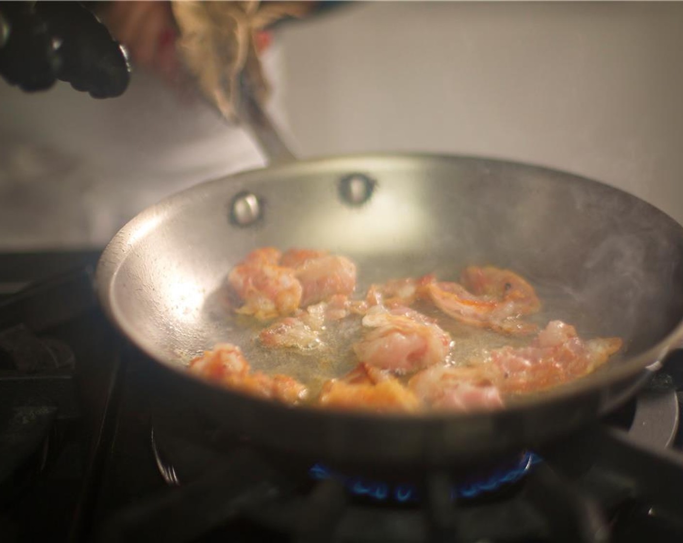 step 8 While the potatoes and tomatoes are roasting, heat a large saute pan over medium-high heat. When hot, add Olive Oil (1/2 tsp) and the Pancetta (3/4 cup). Season with Ground Black Pepper (1/4 tsp) and cook until crisp, about two minutes per side.