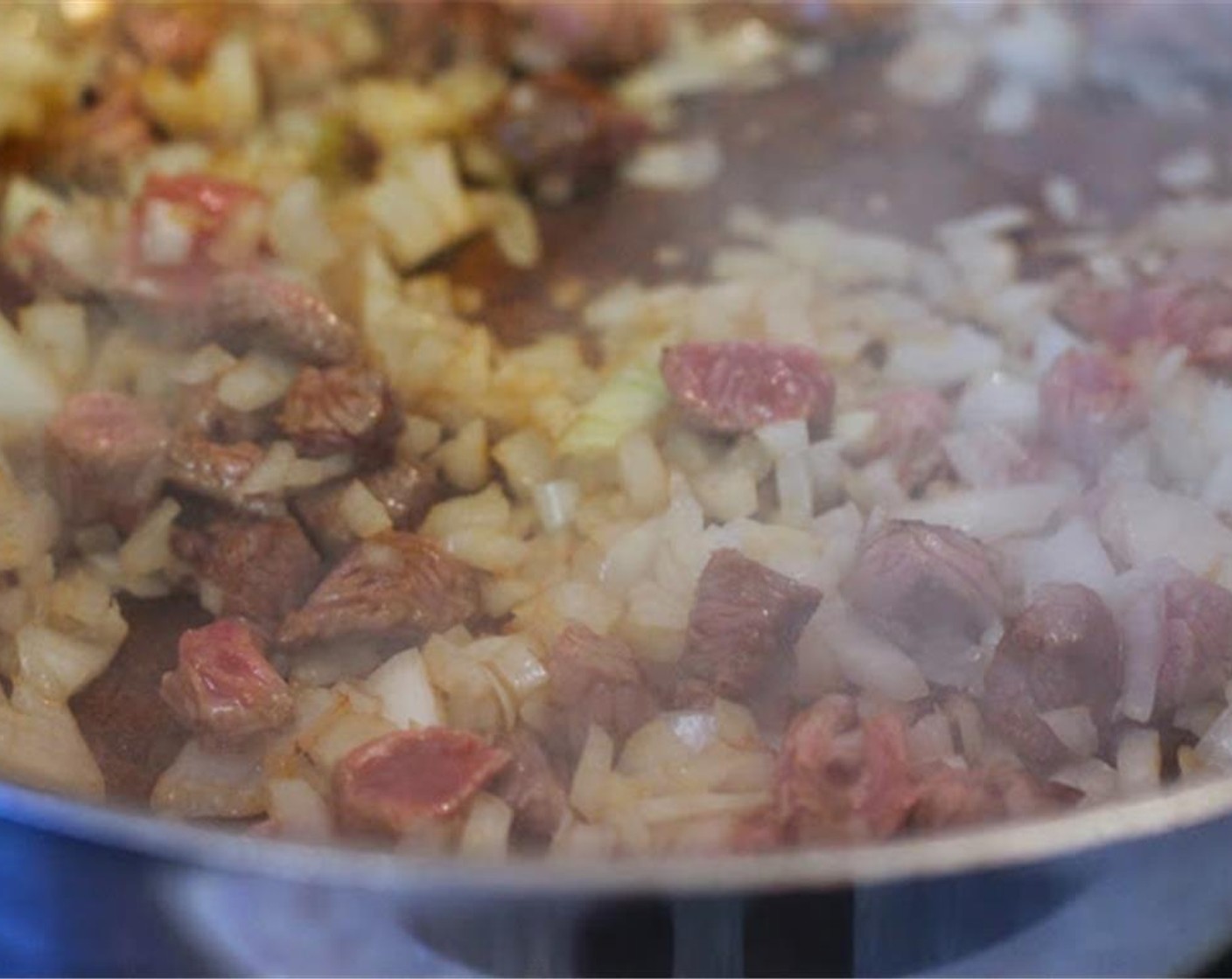 step 2 When the last batch of meat is lightly browned, add Onions (2 cups) and brown a little more.