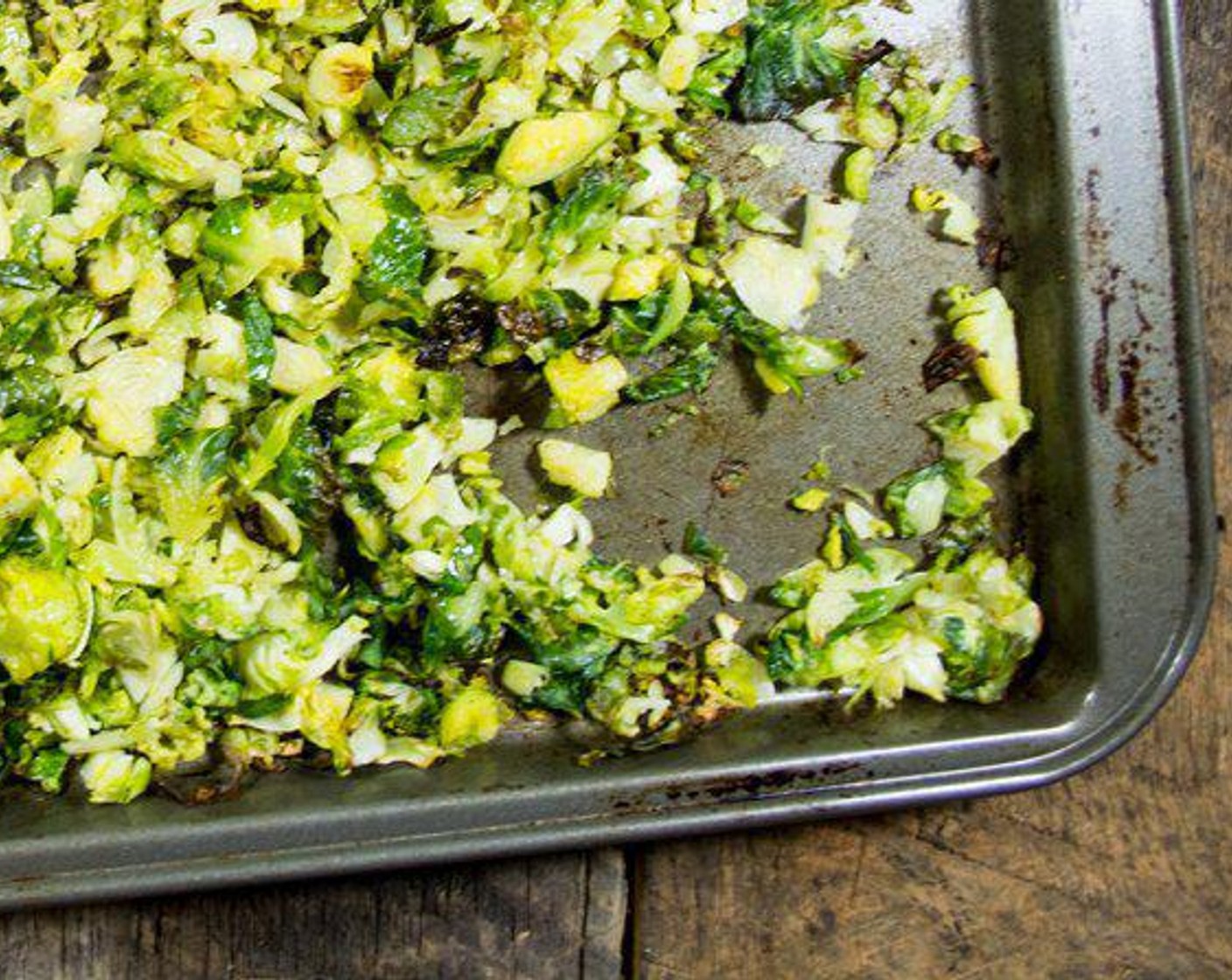 step 4 Add Brussels Sprouts (5 cups), Coconut Oil (1 Tbsp), Garlic Salt (to taste), and Ground Black Pepper (to taste) to baking sheet then toss with fingers to evenly coat. Roast for 15 minutes or until golden brown.