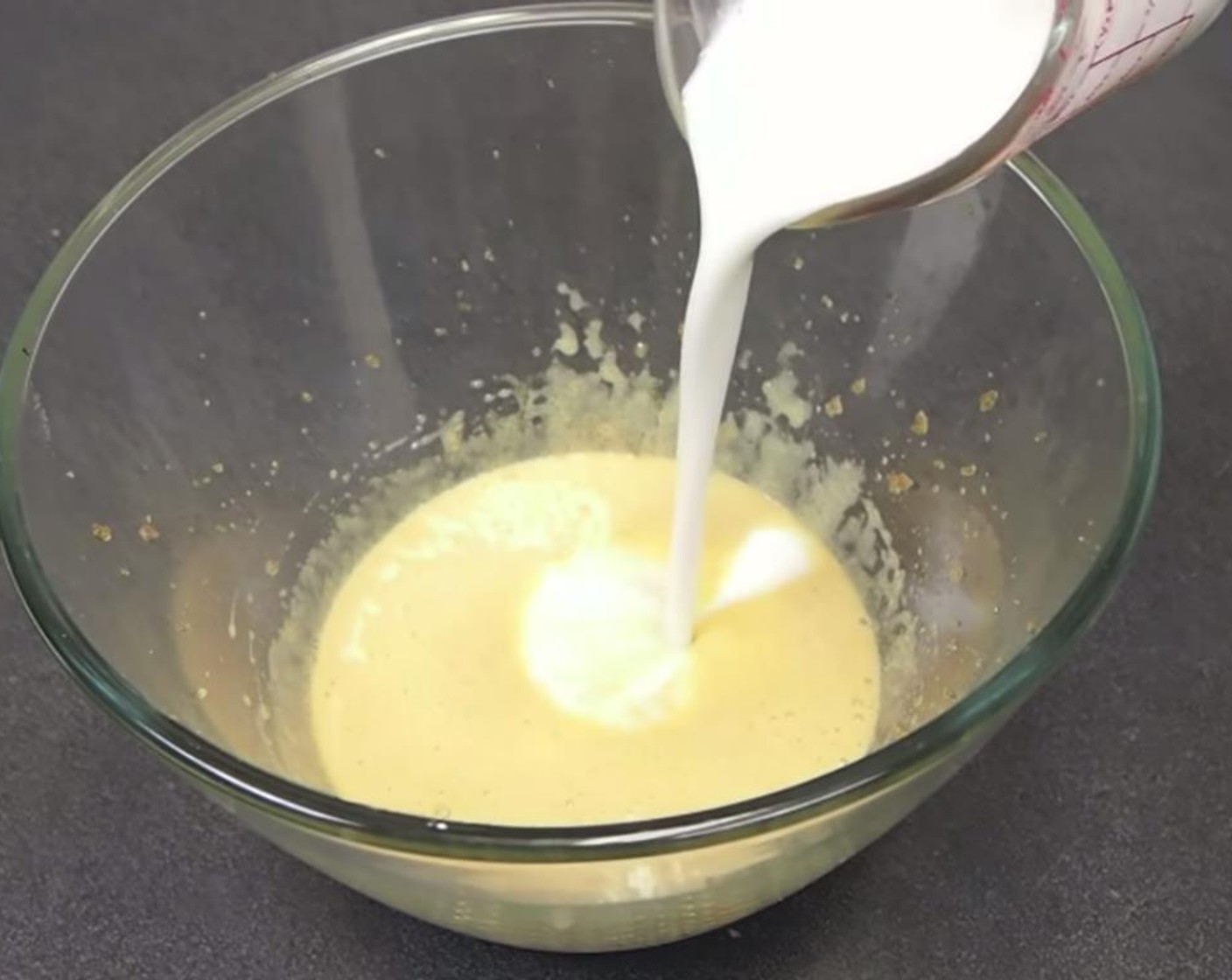 step 1 Preheat the oven 350 degrees F (180 degrees C). In the first bowl, whisk together Canola Oil (1/4 cup), Granulated Sugar (1/2 cup), Vanilla Extract (1 tsp), Milk (3/4 cup) and Egg (1). Whisk until foamy.