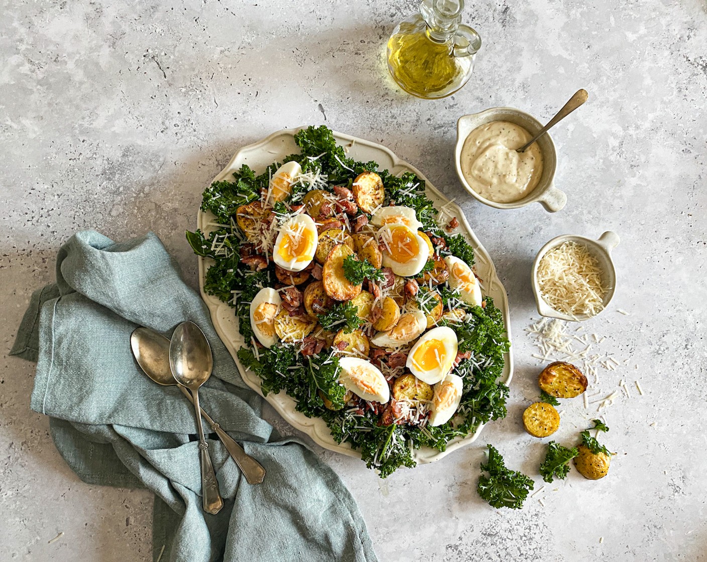 step 10 Layer up the kale onto a platter with roasted potatoes, crispy bacon, eggs, and the remaining parmesan.