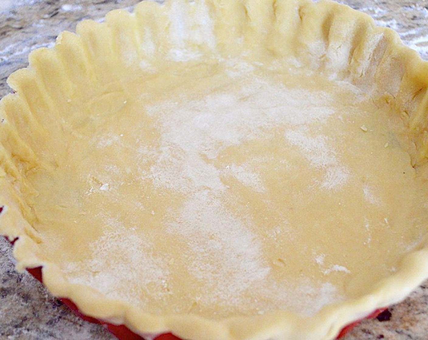 step 2 Add in the Egg (1) and Water (2 Tbsp) and continue to run the processor until it forms a ball. Turn it out onto a floured surface and roll it out to be slightly larger than the tart pan. Press the dough firmly into the tart pan to form the crust, leaving a little dough to hang over. Then chill it in the refrigerator for 30 minutes.