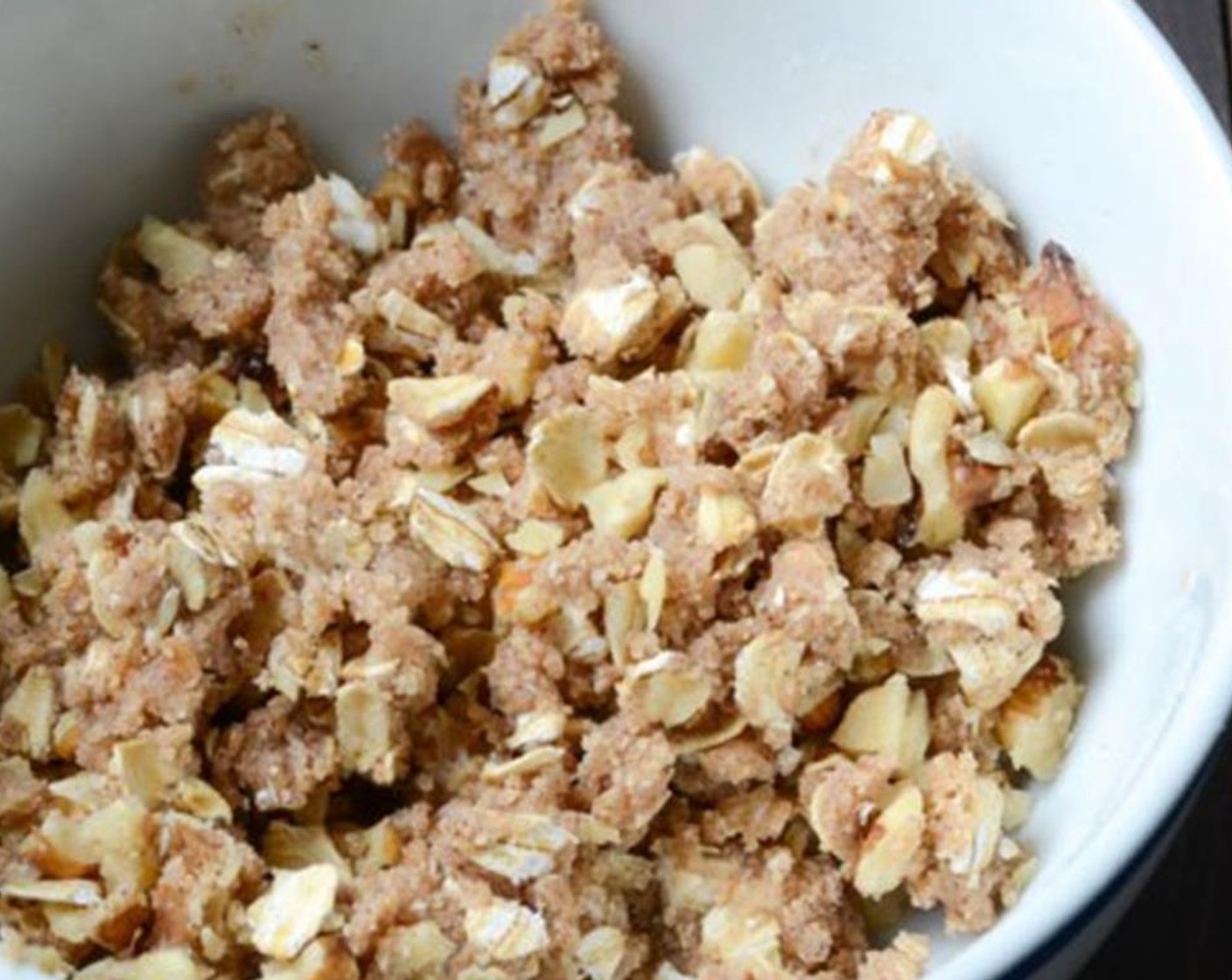 step 3 Mix together with your fingertips until butter is incorporated into the dry ingredients. Add Old Fashioned Rolled Oats (1/4 cup) and Walnut (1/4 cup) and mix thoroughly to combine. Set aside.