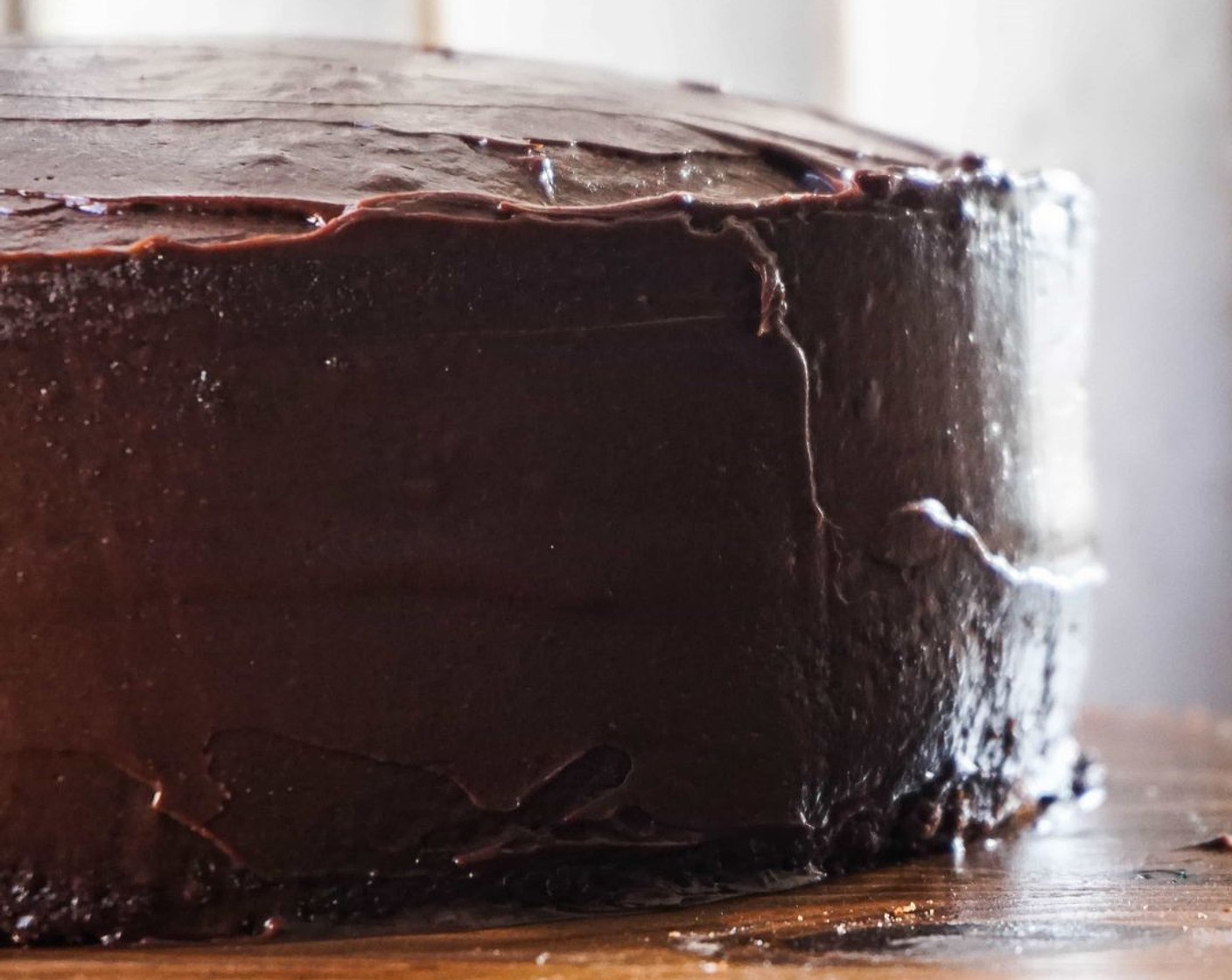 step 12 Once cake has cooled completely in the pan, turn it out onto a flat surface and frost the top with frosting if a sheet cake, or the middle, tops, and sides for a round cake. There will be plenty of frosting either way!