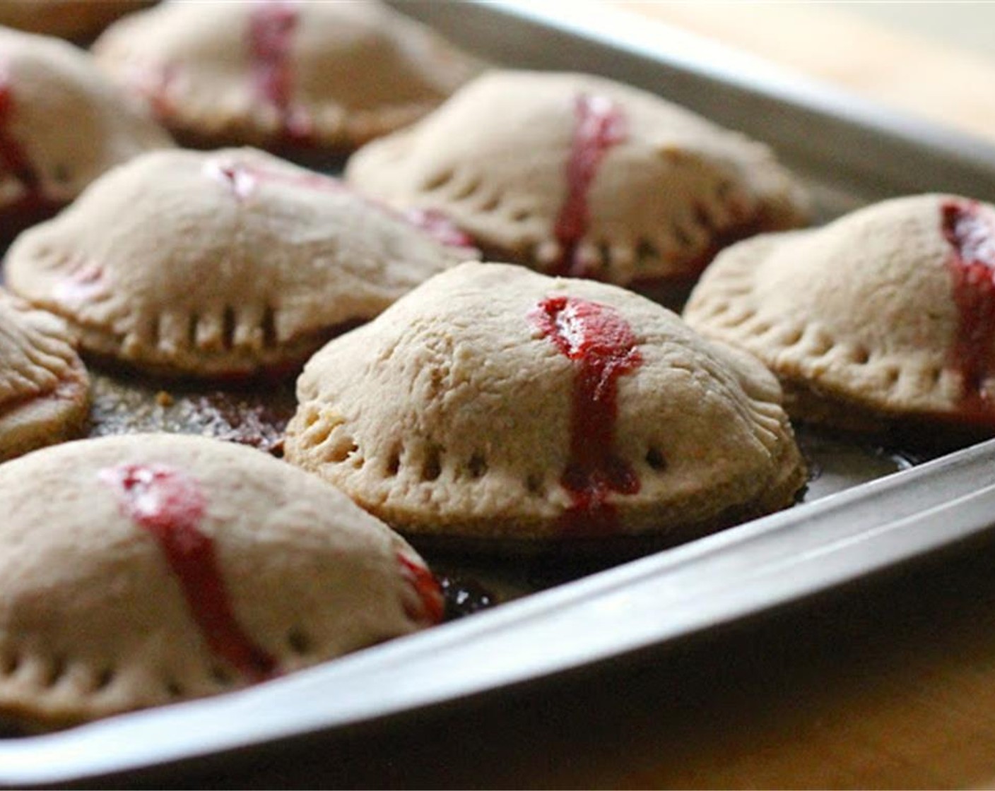 step 12 Cut a slit in the top of each with a knife, and bake for approximately 25 minutes or until slightly golden, with bubbly center. In the meantime, make the icing.