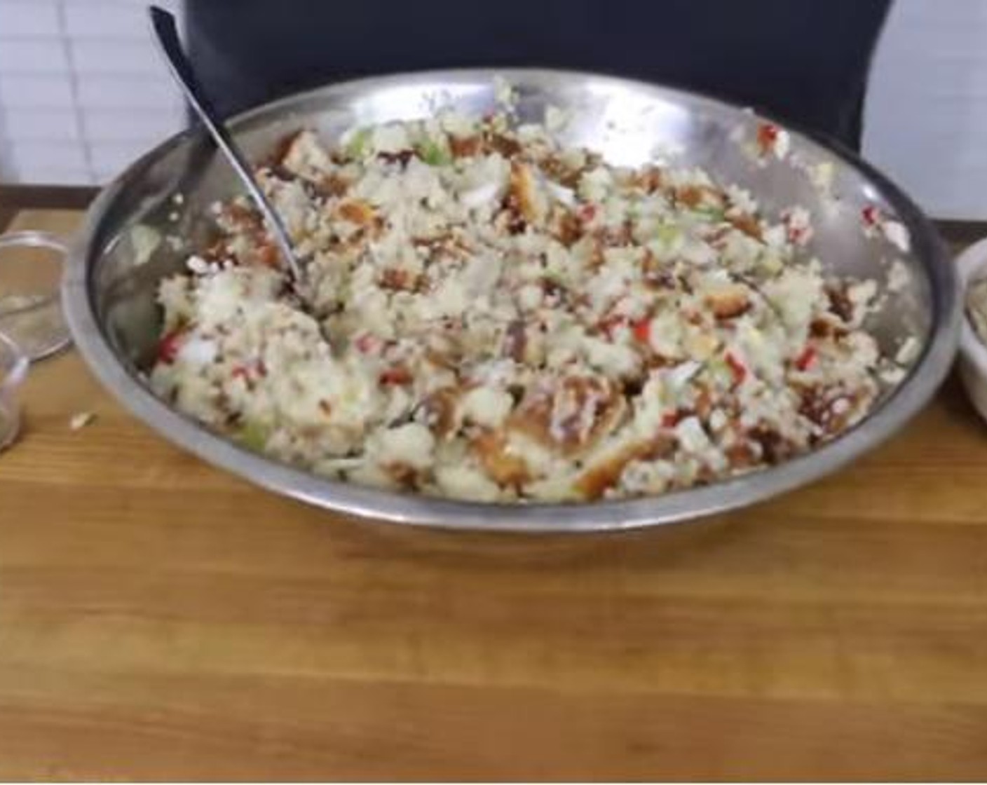 step 6 To make the dressing, first, sauté the Celery (2 stalks) and Onion (1) for 3 minutes. Next, combine the cornbread, hard-boiled eggs, celery, and onion mixture and Pimiento Pepper (1 pckg). Add 2 – 3 cups of the Chicken Stock (4 cups) and mix.