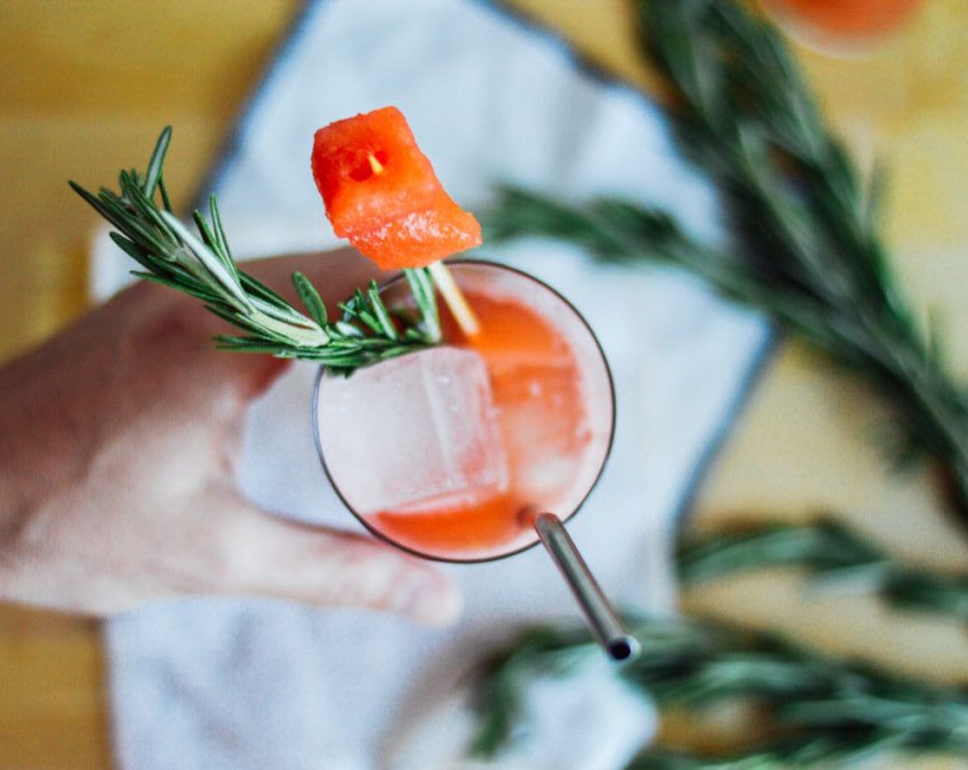 step 3 Fine-strain into an ice-filled glass. Garnish with a watermelon skewer and sprigs of Fresh Rosemary (to taste).